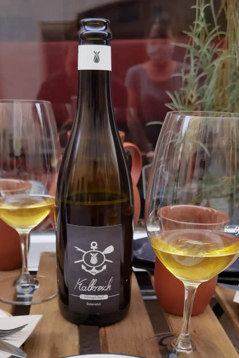 Bottle and 2 glasses of Kalkreich wine - Natural Wiine Dealers