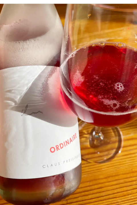 Bottle and glass of Claus Preisinger Ordinaire 2023 - Natural Wine Dealers