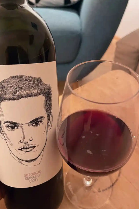 Elegant bottle of Gut Oggau natural wine showcasing artisanal craftsmanship and organic vineyard origins