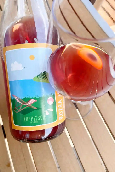 Bottle and glass of Koppitsch Rozsa 2024 - Natural Wine Dealers