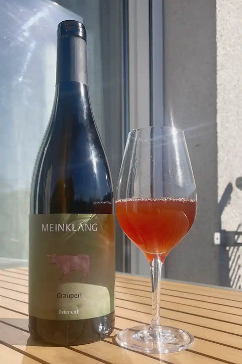 Meinklang Graupert 2022 bottle and glass - Natural Wine Dealers