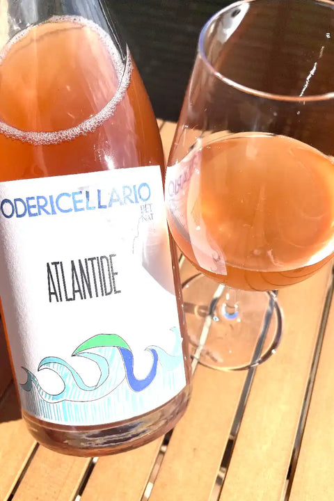 Poderi Cellario Atlantide bottle and glass - Natural Wine Dealers