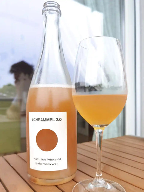 Schrammel Color Orange bottle and glass