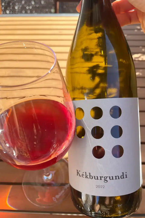 Bottle and glass of Weninger Kekburgundi 2022 - Natural Wine Dealers