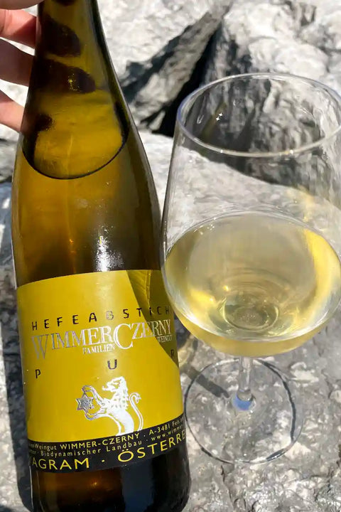 Bottle and glass of Wimmer Czerny Hefeabstich PUR 2023 - Natural Wine Dealers