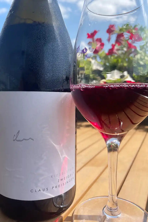 Claus Preisinger Zweigelt Kieselstein 2023 bottle with glass - Natural Wine Dealers