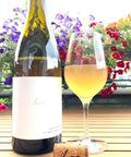 Bottle and glass of Kalkundkiesel Weiss 2023 - Natural Wine Dealers