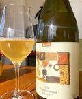 Bottle and glass of Hager Matthias Grüner Veltliner Vielfalt 2021 - Natural Wine Dealers