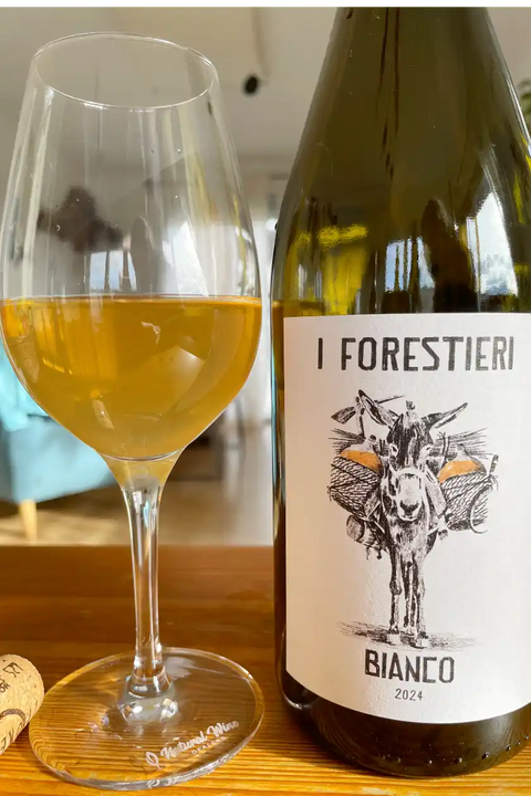Bottle and glass of I Forestieri Bianco 2024 - Natural Wine Dealers