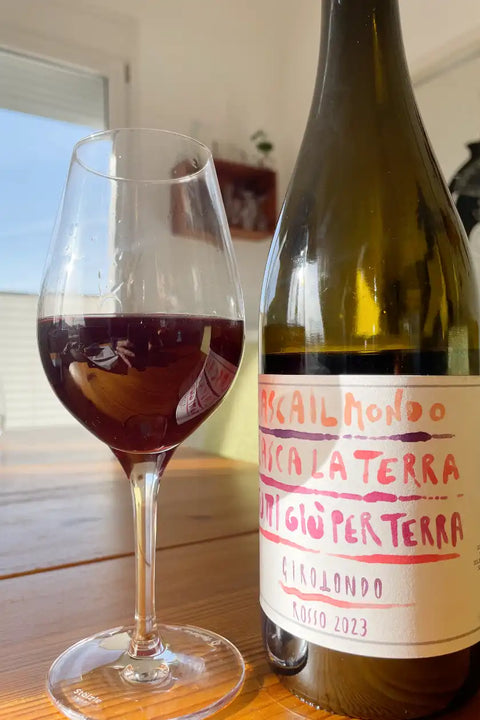 Bottle and glass of I Forestieri Girotondo 2023 - Natureal Wine Dealers