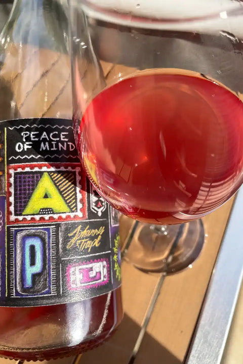 Bottle  and glass of Johannes Trapl Piece of Mind Rosé 2024 - natural Wine Dealers