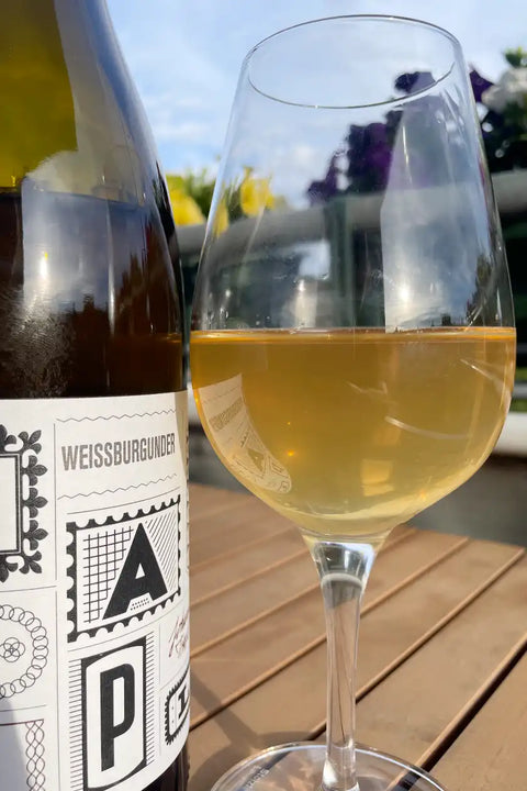 Bottle and glass of Johannes Trapl Weissburgunder 2023 - Natural Wine Dealers