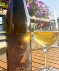 Bottle and a glass of Riesling Sodalis from Michael Gindl - Natural Wine Dealers