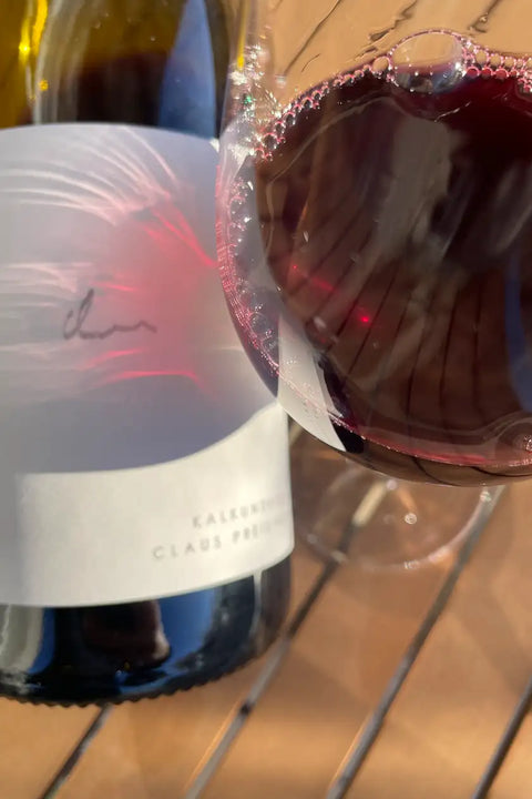 Bottle and glass of Claus Preisinger Kalkundkieselrot 2024 - Natural Wine Dealers