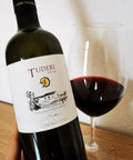 Bottle and glass of Tenute Dettori Tuderi 2016 - Natural Wine Dealers