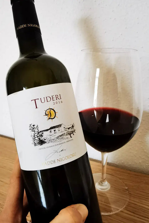 Bottle and glass of Tenute Dettori Tuderi 2016 - Natural Wine Dealers