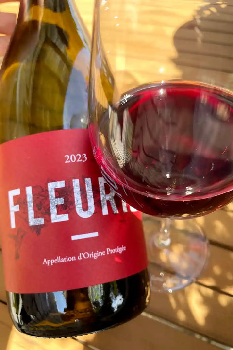 Bottle and glass of Thibault Ducroux Fleurie 2023 - Natural Wine Dealers