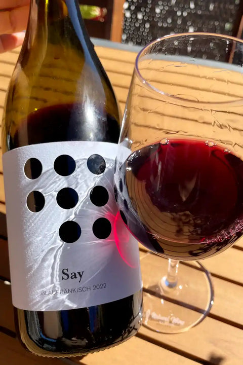 Bottle and glass of Weninger Say Blaufränkisch 2022 - Natural Wine Dealers