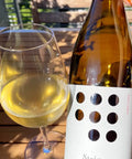 Bottle and glass of Weninger Stein Furmint 2022 - Natural Wine Dealers