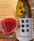 Bottle and glass of Weninger Kekburgundi 2022 - Natural Wine Dealers