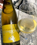 Bottle and glass of Wimmer Czerny Hefeabstich PUR 2023 - Natural Wine Dealers